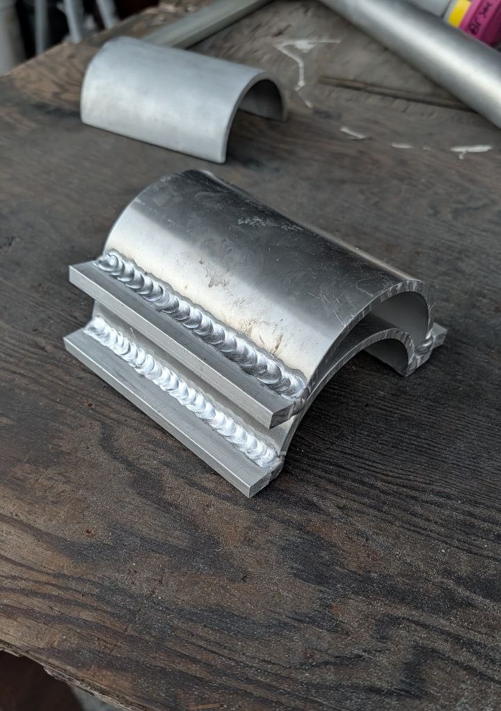 Welding a curved metal piece