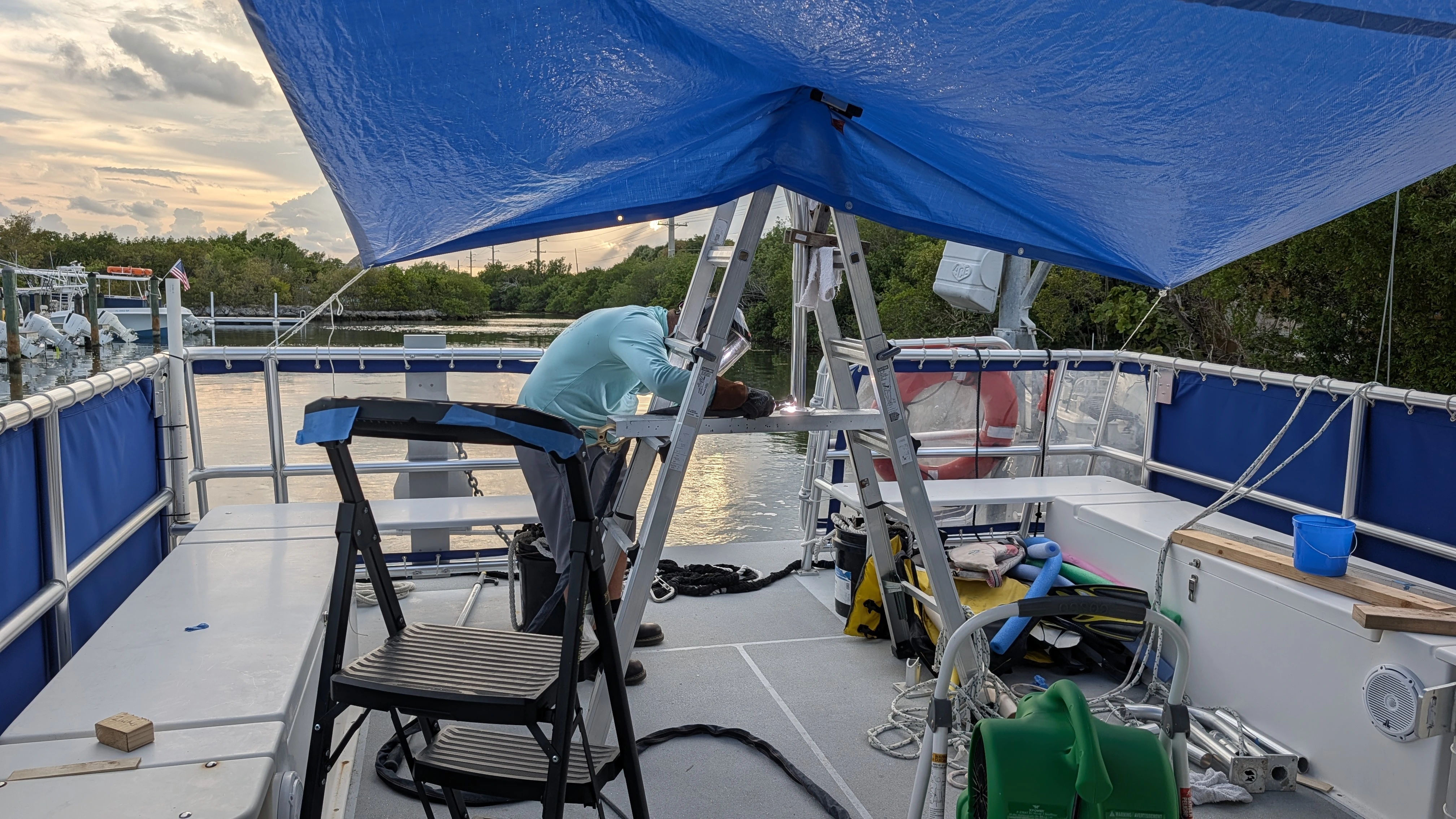 marine fabricator TIG welding structural aluminum pads for boat hardtop